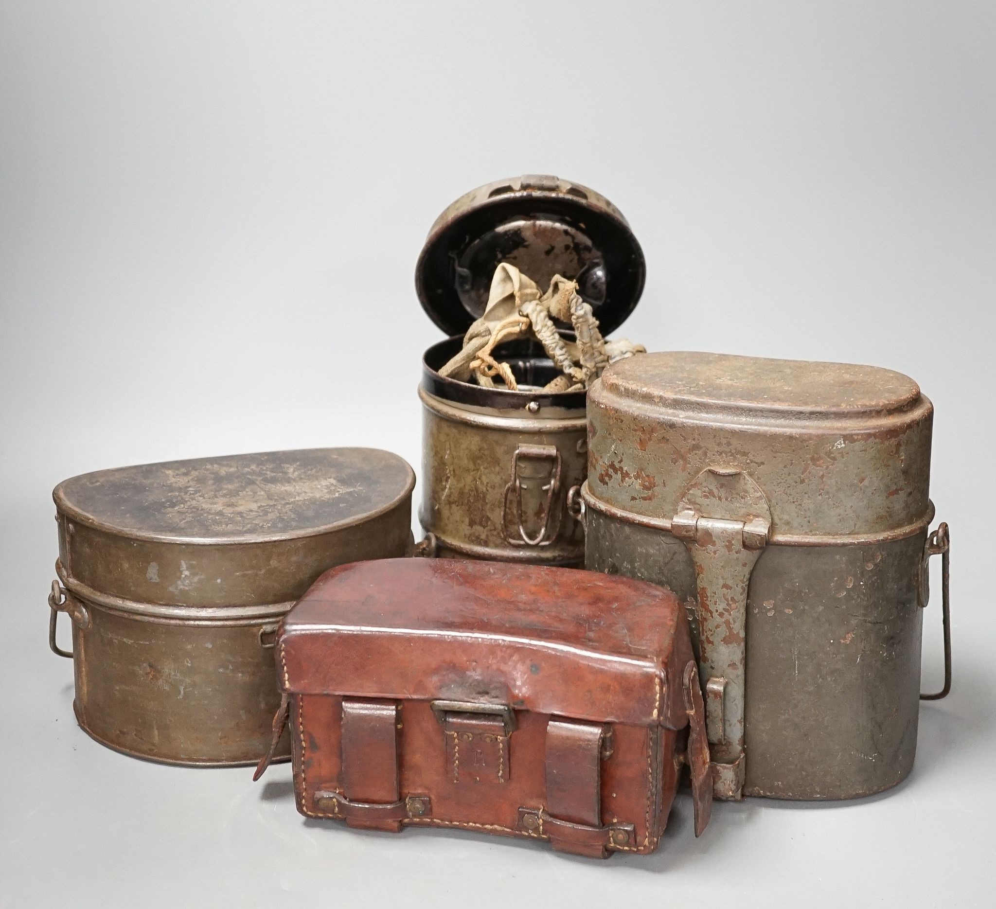 WWI German gas mask, two German trench mess tins and a German leather belt case